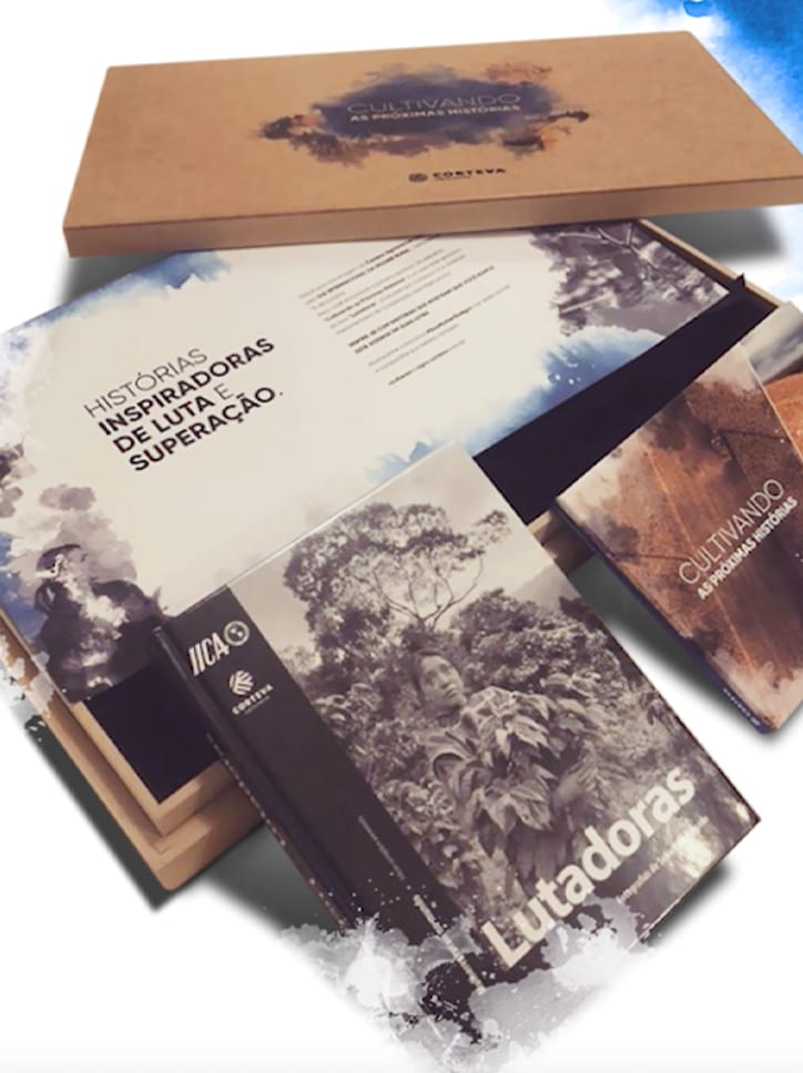 Kit de divulgação entregue para influenciadoras parceiras da Corteva, incluindo o livro "Lutadoras".